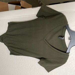 Green small body suit. Good condition .